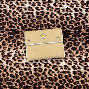 Tan tri-fold Lacoste wallet